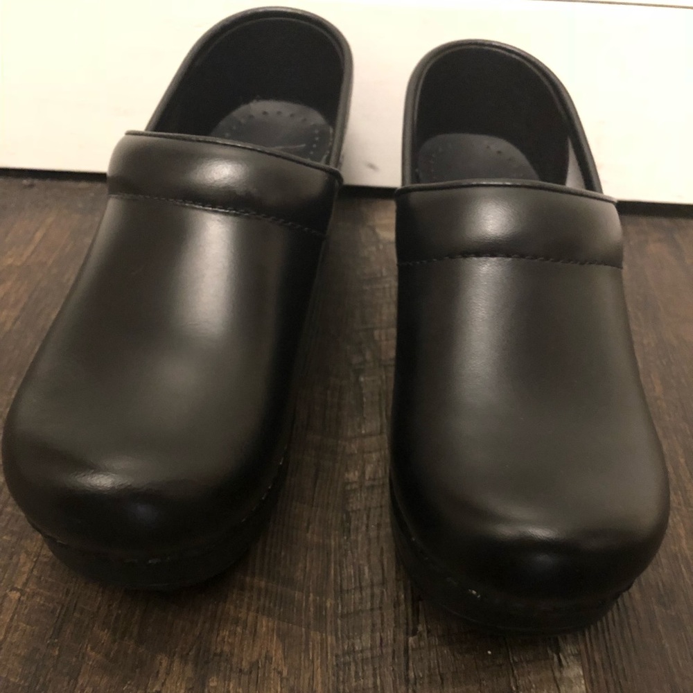 Black dansko women’s clogs. left 36 & right 37